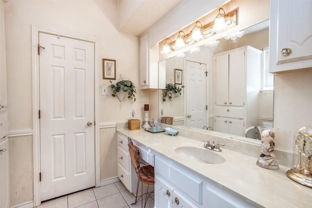 bathroom with tile patterned flooring and vanity