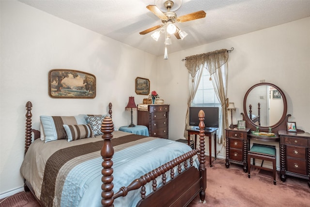 carpeted bedroom featuring ceiling fan and a textured ceiling