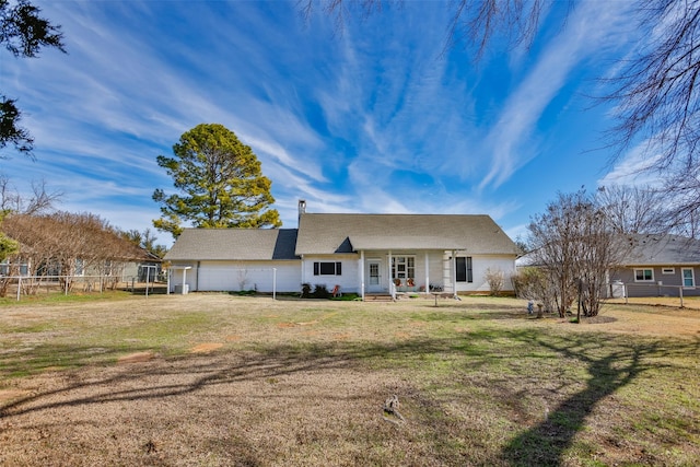 view of front facade featuring a front lawn and a garage