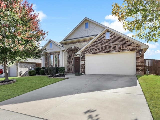 view of front of home with a front lawn and a garage