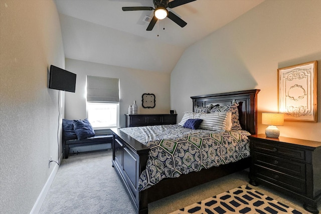 bedroom featuring ceiling fan, vaulted ceiling, and light carpet