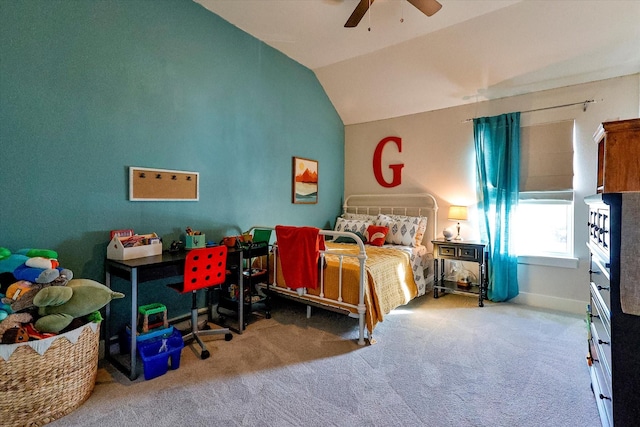 carpeted bedroom with ceiling fan and vaulted ceiling