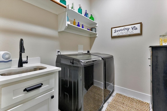 laundry area with sink and independent washer and dryer