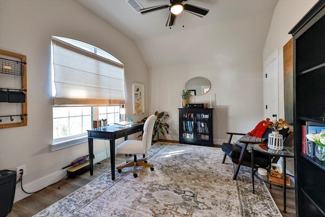 home office featuring ceiling fan, wood-type flooring, and vaulted ceiling