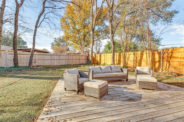 deck with an outdoor hangout area and a lawn