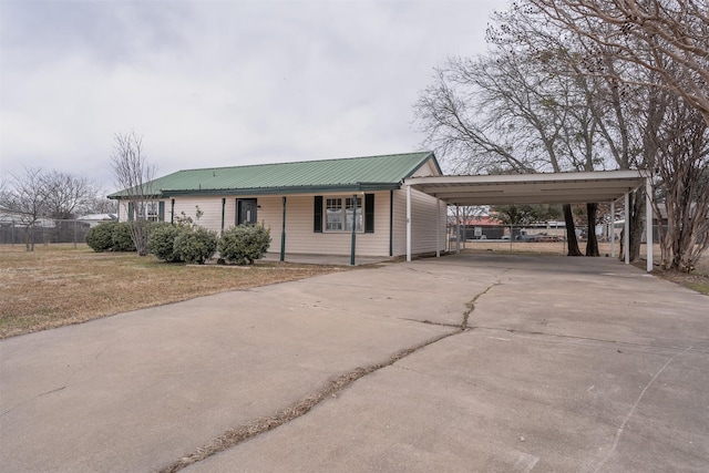 ranch-style house with a front lawn and a carport