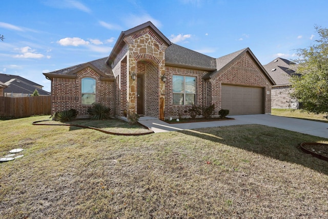 french country home with a garage, fence, roof with shingles, and brick siding