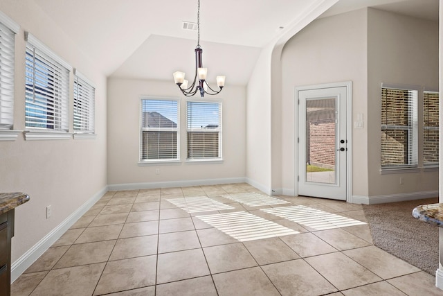 unfurnished dining area with lofted ceiling, light tile patterned floors, and a notable chandelier