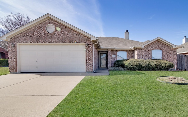 ranch-style house featuring a front yard and a garage