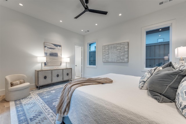 bedroom featuring ceiling fan and hardwood / wood-style floors