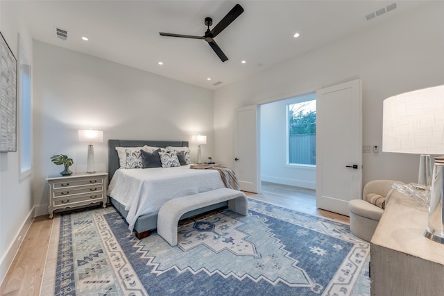 bedroom featuring ceiling fan and hardwood / wood-style floors