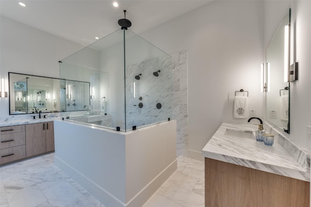 bathroom with walk in shower and vanity