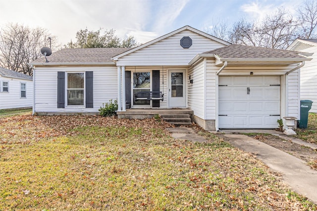 single story home with a garage and a front lawn