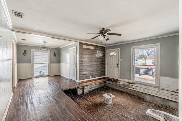 interior space featuring hardwood / wood-style flooring, ornamental molding, and ceiling fan