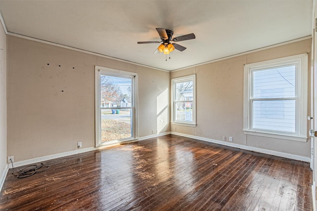 spare room with ceiling fan, dark hardwood / wood-style flooring, and crown molding