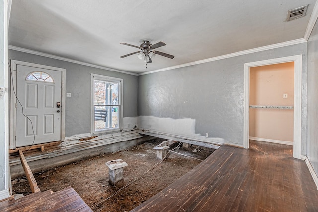 foyer with ceiling fan, dark hardwood / wood-style flooring, and crown molding