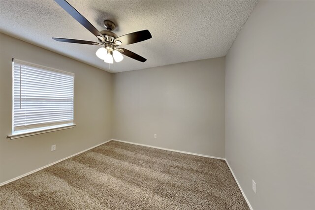 carpeted empty room featuring a textured ceiling and ceiling fan