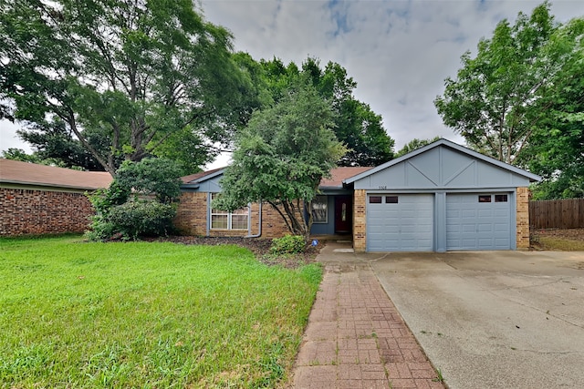 single story home with a garage and a front yard