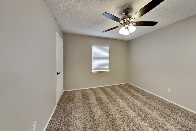 unfurnished room featuring ceiling fan, a textured ceiling, and carpet floors