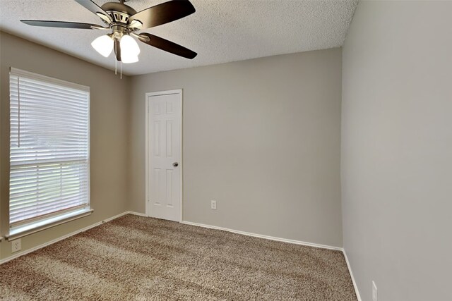 bathroom featuring a textured ceiling and vanity