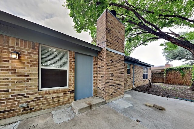 property entrance with a patio area