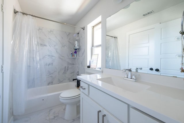 full bathroom featuring vanity, shower / tub combo, and toilet