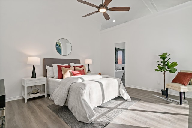 bedroom with ceiling fan and hardwood / wood-style flooring