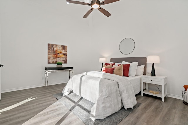 bedroom featuring ceiling fan and dark wood-type flooring