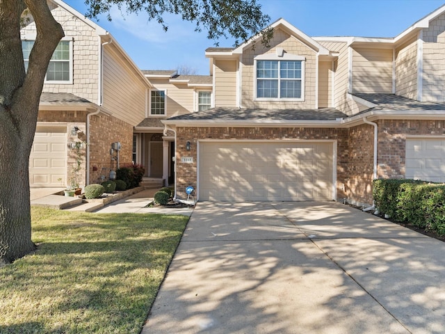 view of front of house with a garage and a front yard