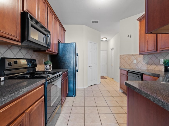 kitchen with light tile patterned flooring, decorative backsplash, and black appliances