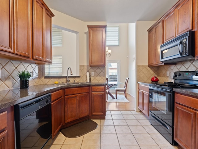 kitchen with light tile patterned flooring, sink, backsplash, and black appliances