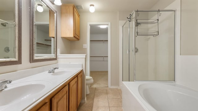 full bathroom with toilet, shower with separate bathtub, tile patterned floors, and vanity