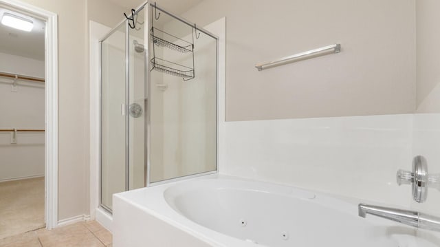 bathroom with tile patterned floors and separate shower and tub