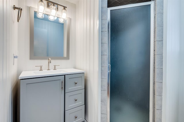 bathroom featuring an enclosed shower and vanity