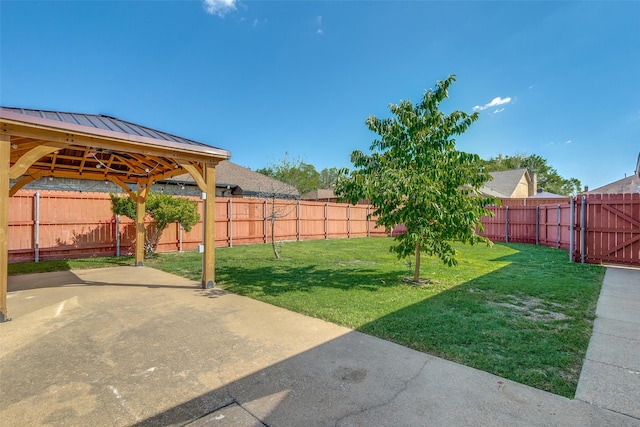 view of yard with a patio area, a fenced backyard, and a gazebo