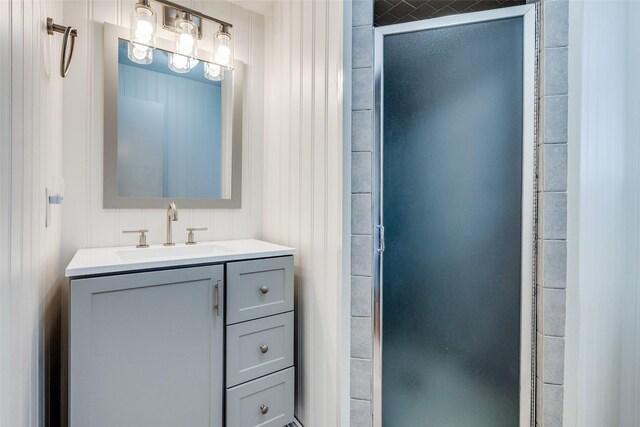 bathroom featuring shower / bath combo with shower curtain, vanity, and tile patterned flooring