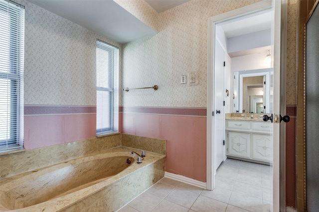 bathroom featuring a bathtub, tile patterned floors, and vanity