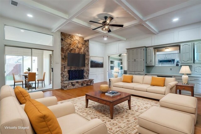 tiled entrance foyer with ornamental molding and ceiling fan with notable chandelier