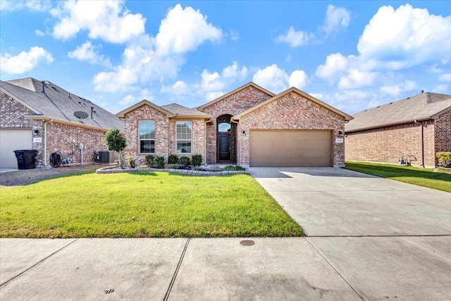 ranch-style home with central AC, a garage, and a front yard