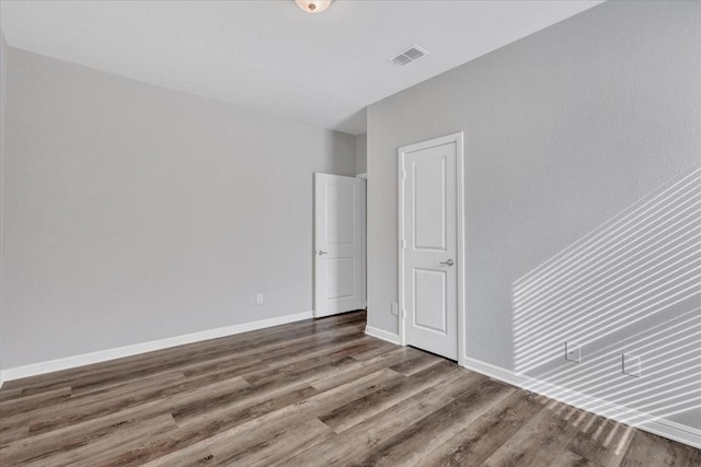 unfurnished bedroom featuring hardwood / wood-style floors