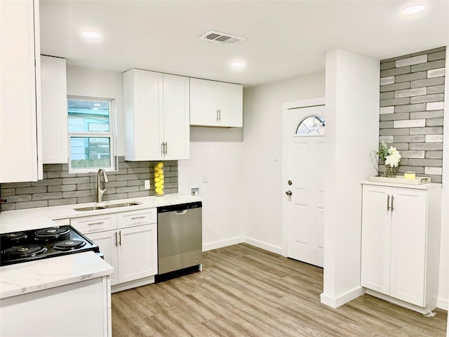 kitchen featuring sink, dishwasher, white cabinets, light hardwood / wood-style floors, and backsplash