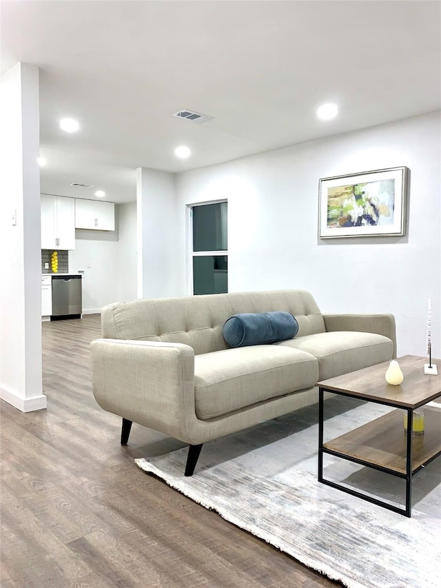 living room with light hardwood / wood-style flooring