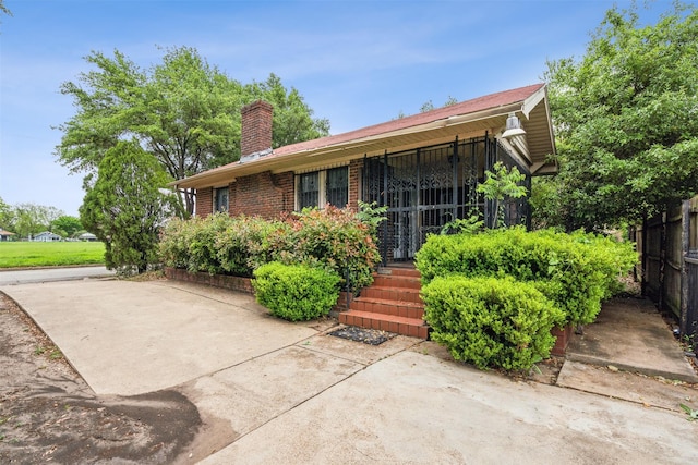 back of property with a patio