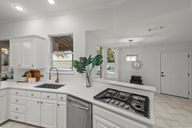 kitchen featuring stainless steel appliances, sink, and white cabinets