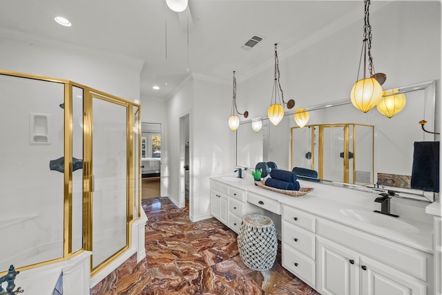 bathroom featuring ornamental molding, vanity, and walk in shower