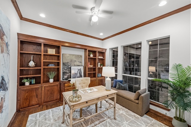 office space featuring hardwood / wood-style flooring, ornamental molding, and ceiling fan