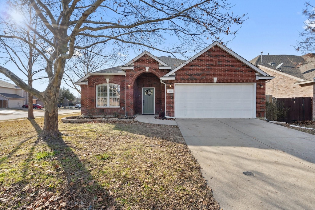 view of front of house with a garage and a front lawn