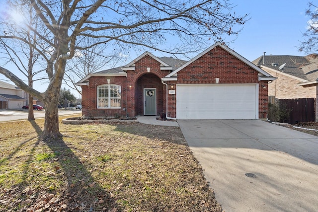 view of front of house with a garage and a front lawn