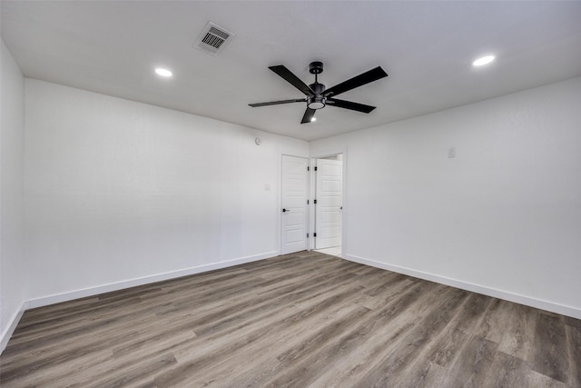 unfurnished room featuring ceiling fan and hardwood / wood-style flooring