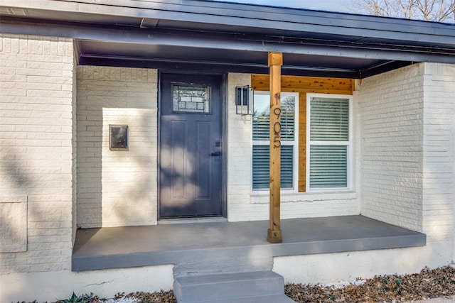 property entrance featuring covered porch